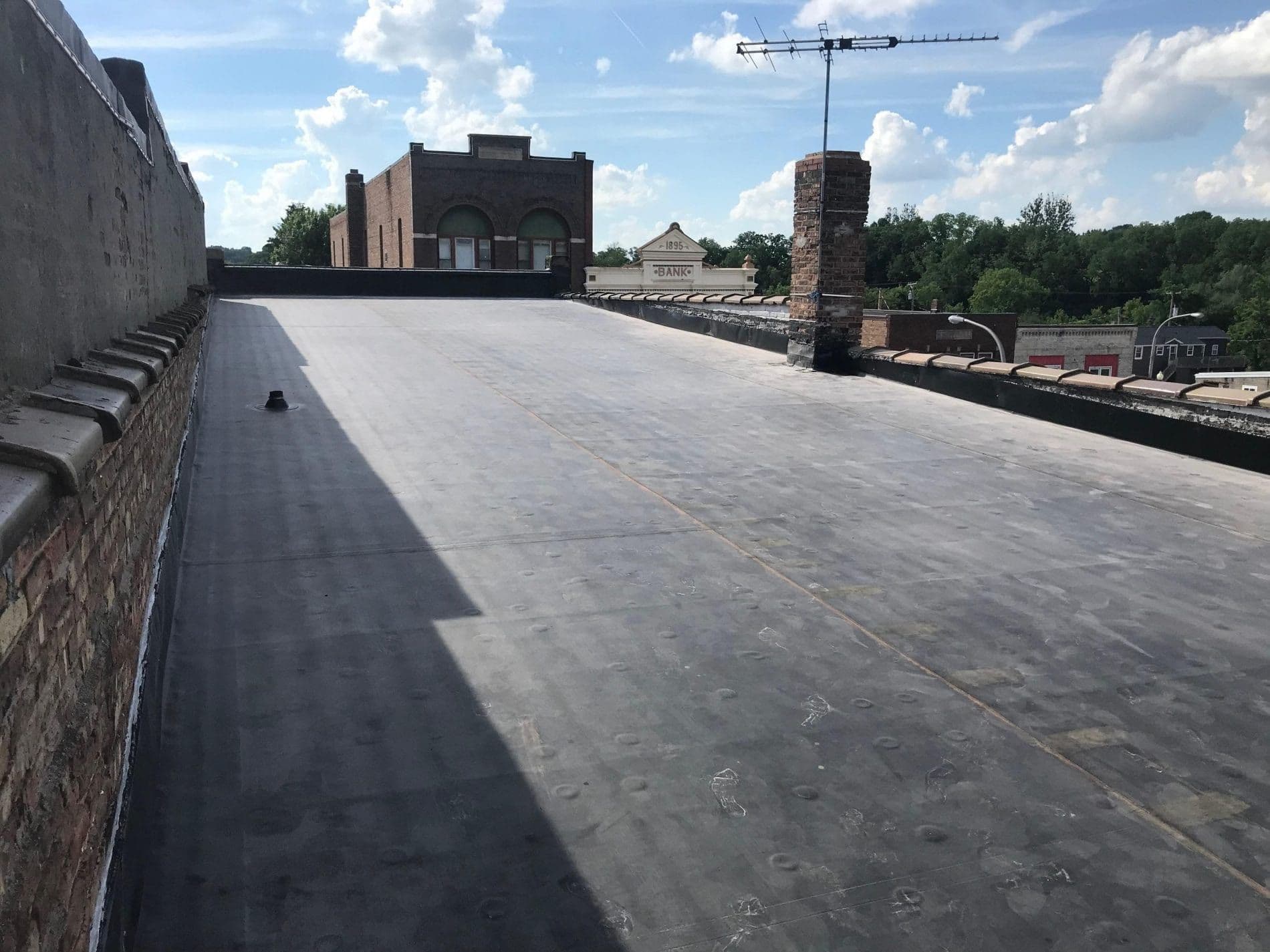A building with new black flat roofing.