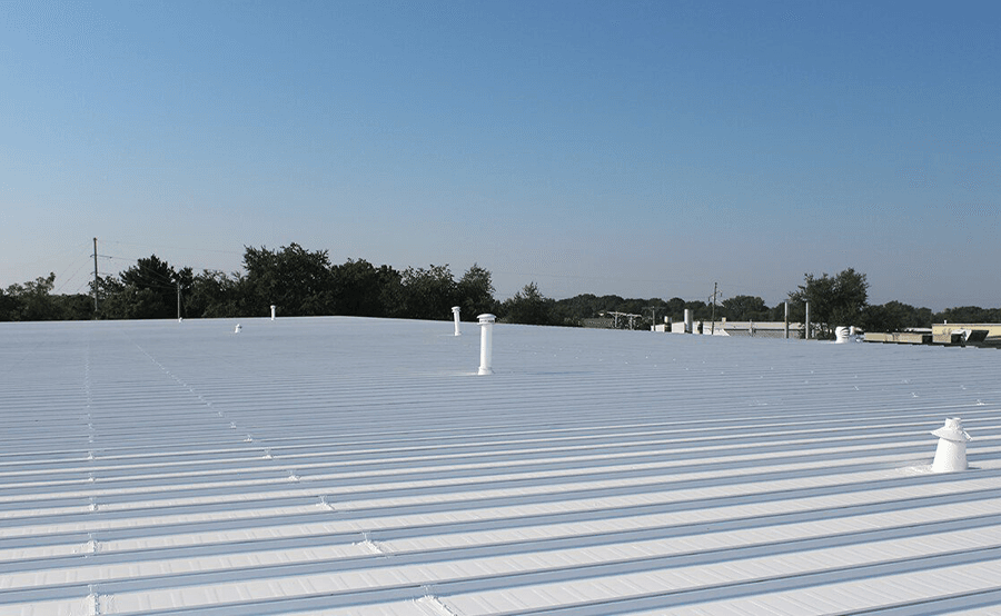 A commercial building with a white polyurea spray coating.